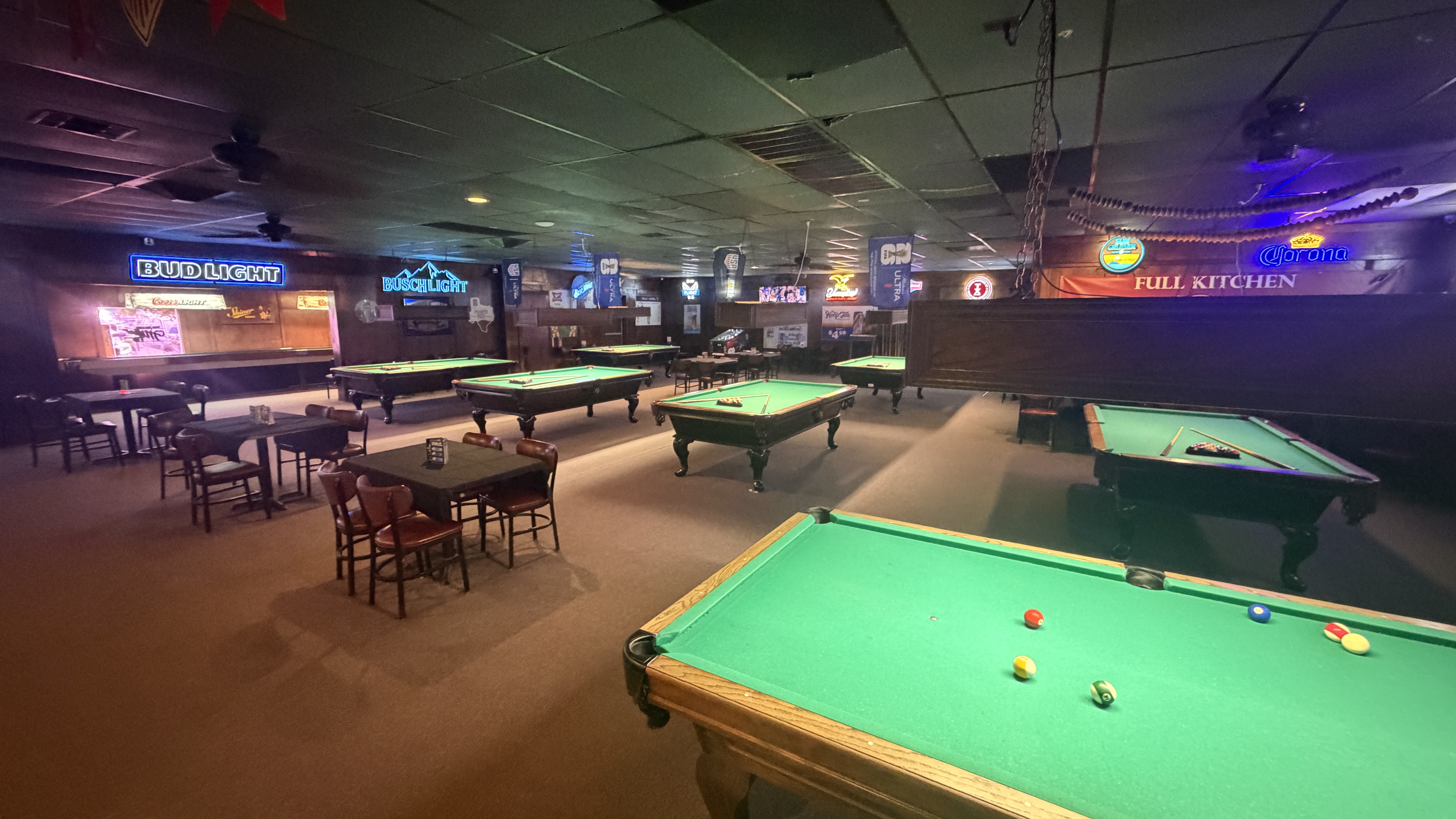 Pool hall with multiple tables at Yesterdays Bar & Grill
